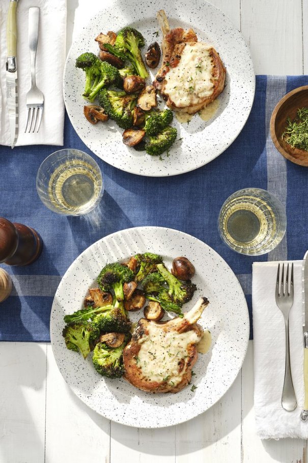 This deliciously pan-seared pork chop is smothered in a crème fraîche and white wine sauce. Paired with simply roasted veggies, it's a surefire dinner winner.