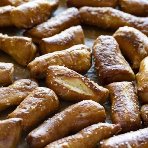 These Homemade Soft Pretzel Bites are the perfect snacking appetizer.  Soft pretzels coated with sea salt for a subtle crunch, these little bite-sized treats will fly off the table!