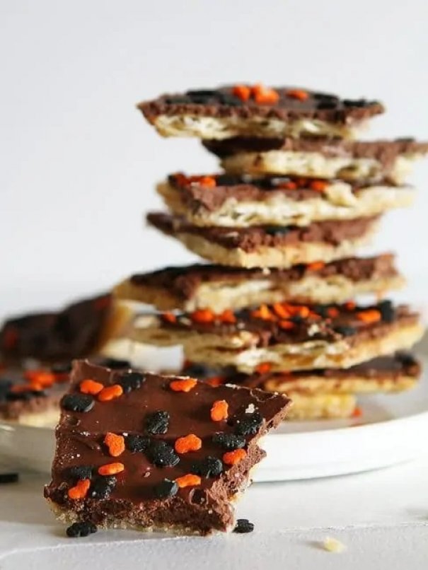 Halloween Saltine Toffee is so addicting, you will want to make up your own holidays for an excuse to make it again!