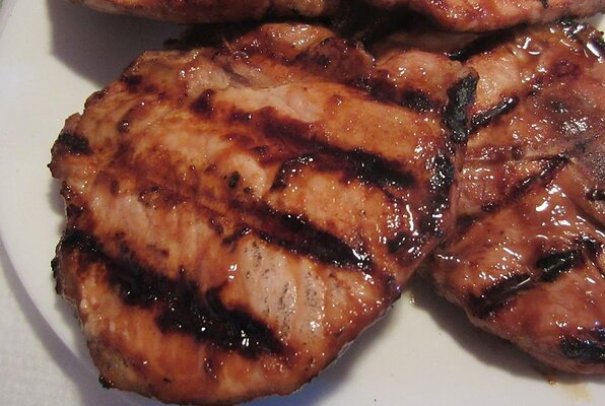 A quick and simple grilled pork chop that everyone will love featuring a simple and easy glaze.