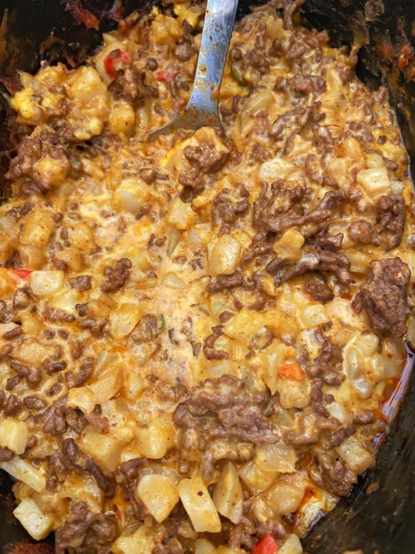 Casserole is filled with a cheesy Mexican sauce, diced potatoes with bell peppers, onions, and ground beef! This simple, gluten-free recipe is a quick dinner the whole family can dig in and enjoy.