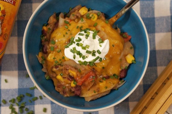 This hearty cheesy crockpot cowboy casserole will knock your boots off! Loaded with beef, beans, potatoes and cheese this gluten free dinner is easy to prep and dinner will be done for all your cowgirls and cowboys when they come home.