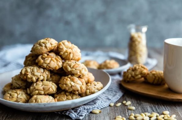 Pignoli are classic Italian cookies that embody simplicity. They're chewy and rich, plus they pack a big almond punch along with the pine nuts.